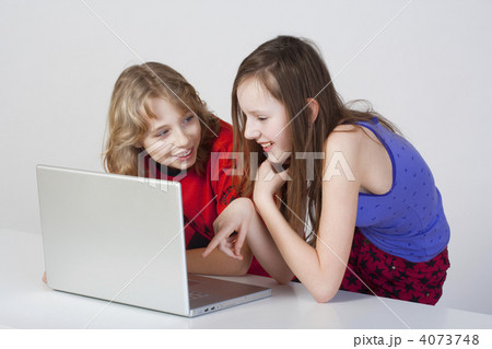 boy and girl with laptop boy and girl with laptop 4073748