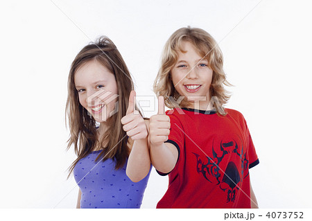 boy and girl showing thumbs up boy and girl showing thumbs up 4073752