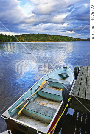 Rowboat docked on lake 4076522