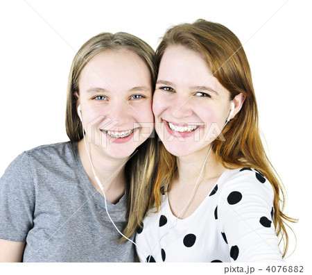 Two teenage girls listening to music 4076882