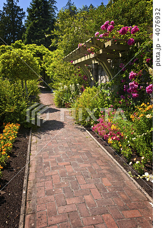 Flower garden with paved path 4076932