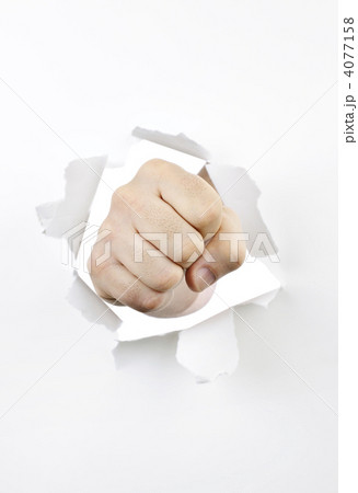 Fist punching through hole in paper 4077158