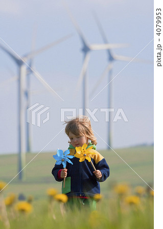 boy with pinwheel and wind farm 4079953
