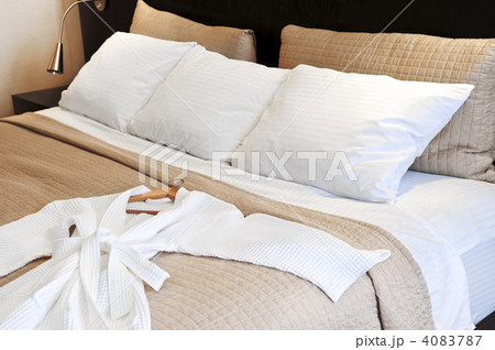 Hotel bed with bathrobe 4083787