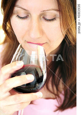 Mature woman with a glass of red wine Mature woman with a glass of red wine 4083936