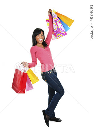 Excited young black woman with shopping bags 4084691