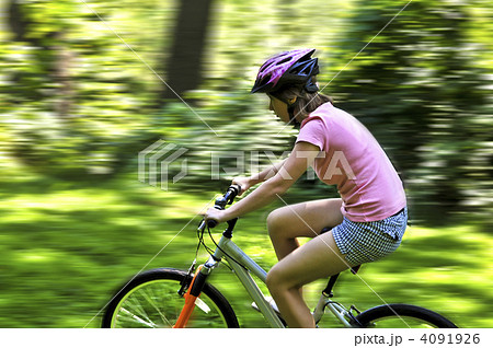 Teenage girl on a bicycle Teenage girl on a bicycle 4091926