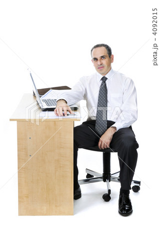 Businessman at his desk on white background Businessman at his desk on white background 4092015