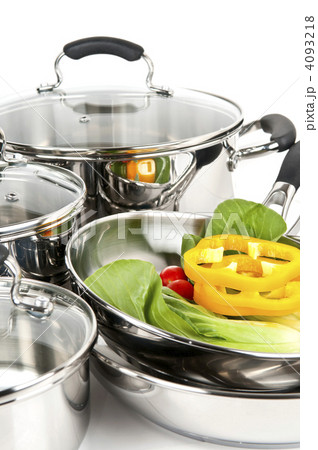 Stainless steel pots and pans with vegetables 4093218