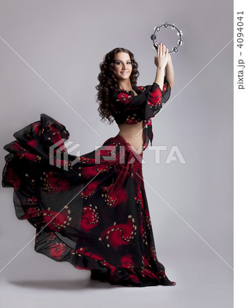 Young woman dance flamenco with tambourine 4094041
