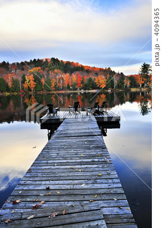 Wooden dock on autumn lake Wooden dock on autumn lake 4094365