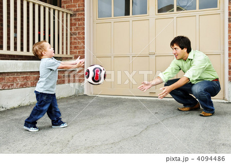 Father and son playing soccer Father and son playing soccer 4094486