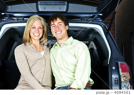 Couple sitting in back of car Couple sitting in back of car 4094501