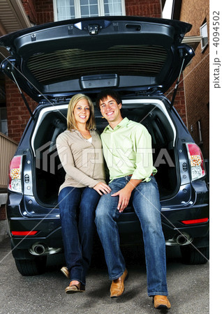 Couple sitting in back of car Couple sitting in back of car 4094502