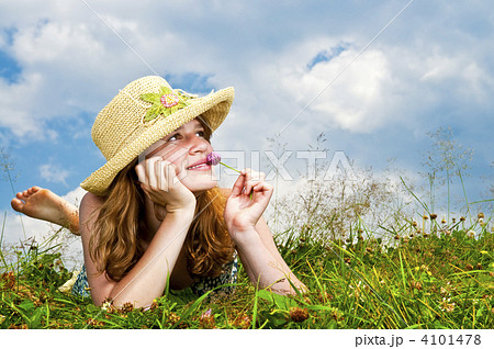 Young girl laying in meadow 4101478