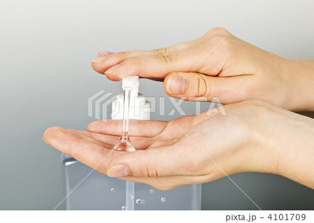 Hands applying sanitizer gel 4101709