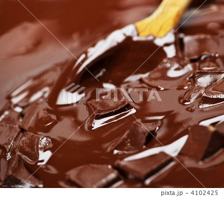 Melting chocolate and spoon Melting chocolate and spoon 4102425