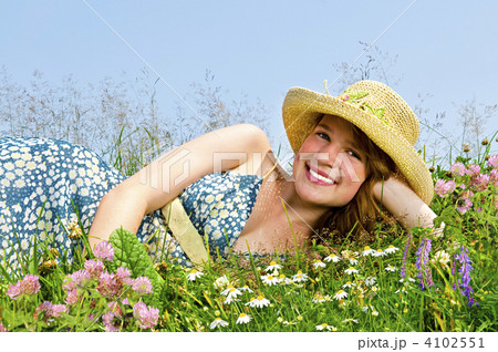 Young girl laying on meadow Young girl laying on meadow 4102551
