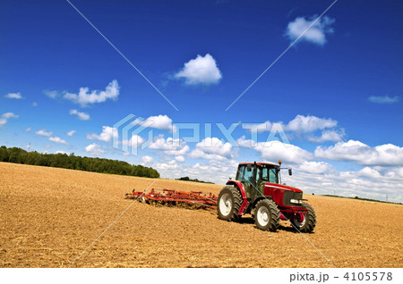 Tractor in plowed field 4105578