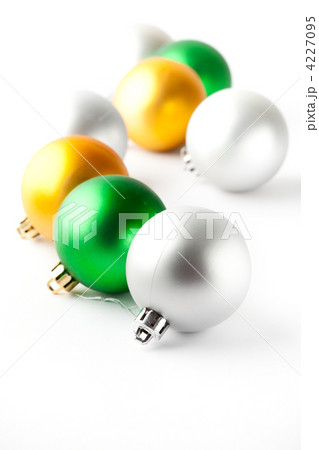 Green, gold and silver Christmas baubles on white 4227095