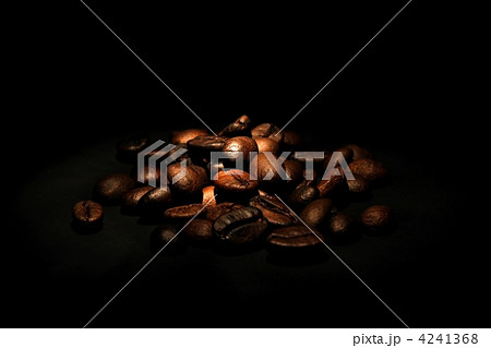 heap of coffee beans on black background heap of coffee beans on black background 4241368