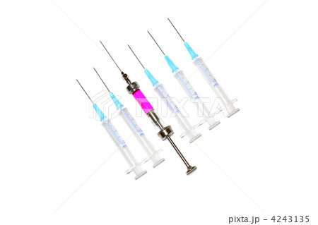 six syringes in row on white background six syringes in row on white background 4243135