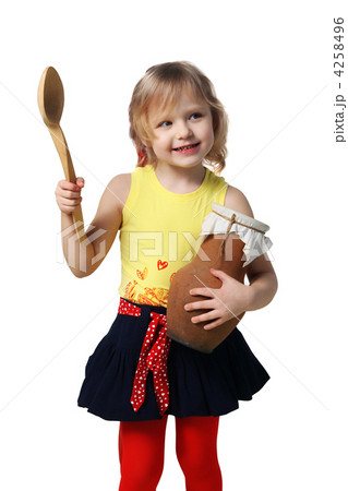 Little girl with a wooden spoon and crock 4258496