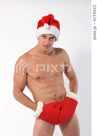 Sexy muscular man wearing a Santa Claus hat 4259022