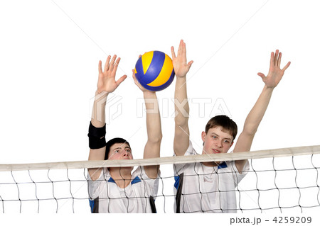 Volleyball players with the ball on a white Volleyball players with the ball on a white 4259209