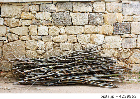 Firewood against the old brick wall 4259965