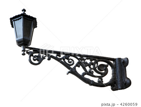 Old black street lamp on the white background Old black street lamp on the white background 4260059