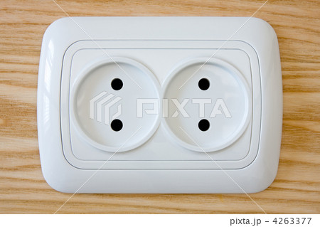 white electric outlet on wooden wall 4263377