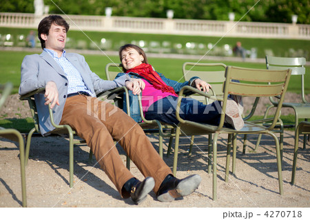 Young french couple relaxing in the Luxembourg Garden of Paris Young french couple relaxing in the Luxembourg Garden of Paris 4270718