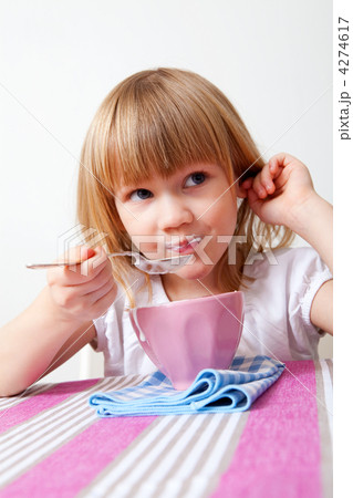 Little girl eating breakfast 4274617
