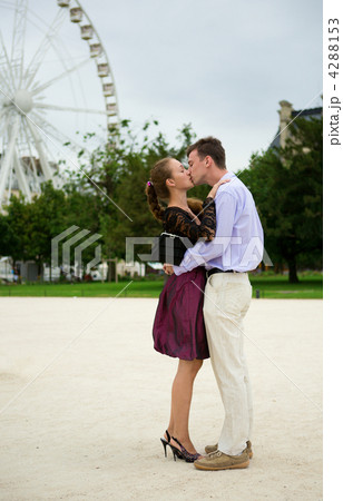 Romantic couple in Paris kissing near big dipper Romantic couple in Paris kissing near big dipper 4288153