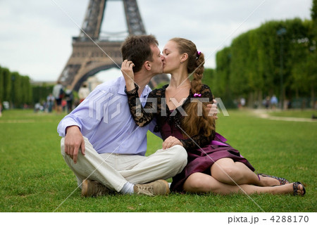Romantic couple in Paris kissing near the Eiffel Tower Romantic couple in Paris kissing near the Eiffel Tower 4288170