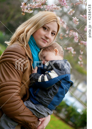Beautiful young mother with her son at spring Beautiful young mother with her son at spring 4288438