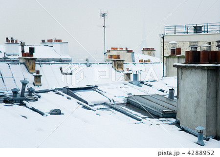 Rare snowy day in Paris. Parisian roofs covered with snow and th Rare snowy day in Paris. Parisian roofs covered with snow and th 4288952