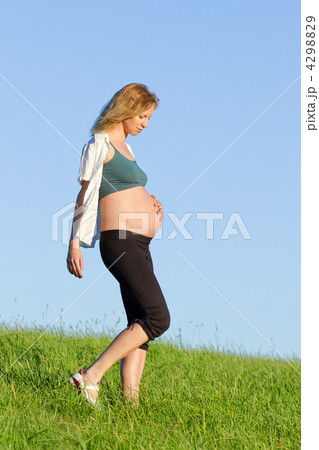 pregnant woman on meadow 4298829