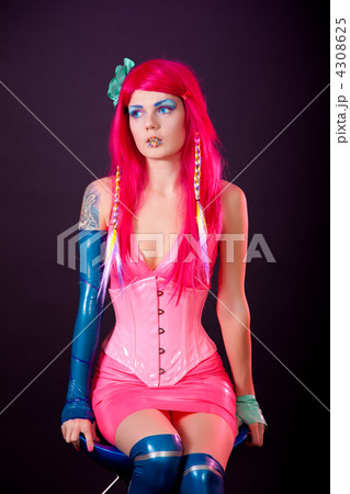 Young woman dressed in bright latex clothes 4308625