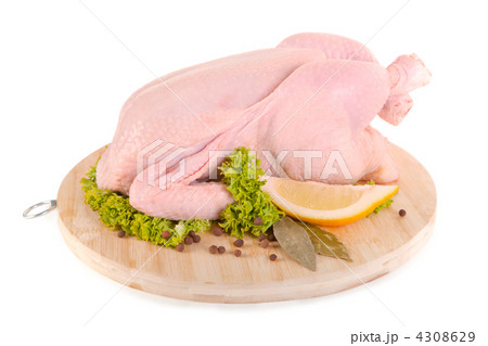 Fresh raw chicken and condiments on wooden board 4308629