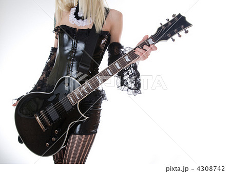 Close-up of girl with black electro guitar Close-up of girl with black electro guitar 4308742