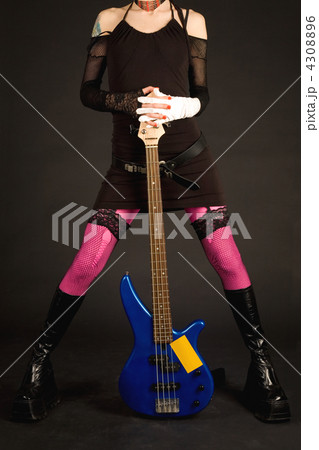 Close-up of girl’s legs with guitar Close-up of girl’s legs with guitar 4308896