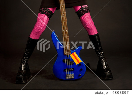Close-up of woman legs with guitar Close-up of woman legs with guitar 4308897