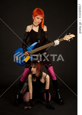 Two attractive girls with guitar Two attractive girls with guitar 4308907