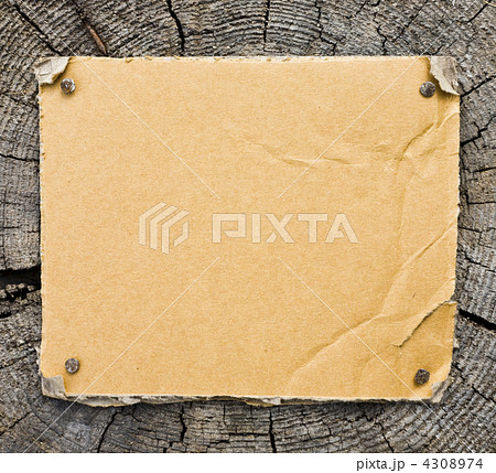 Cardboard On Wooden Background Cardboard On Wooden Background 4308974