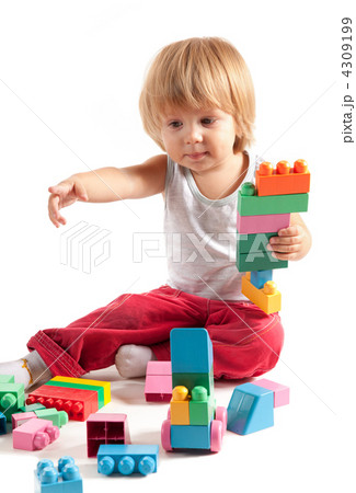 Cute little boy playing with blocks Cute little boy playing with blocks 4309199