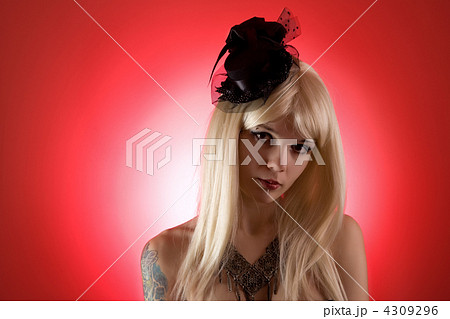 Portrait of cabaret girl in mini top hat 4309296