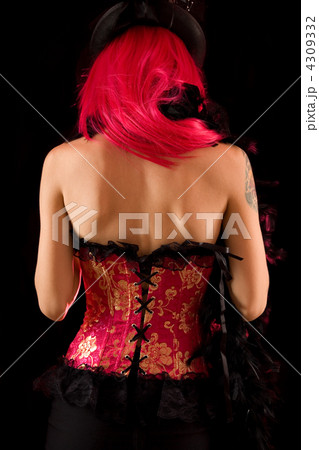 Rear view of cabaret girl in pink corset and hat 4309332
