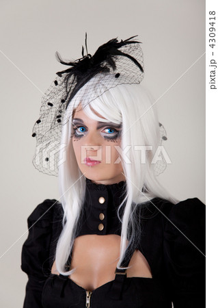 Fantasy girl with creative make-up and blue contact lenses Fantasy girl with creative make-up and blue contact lenses 4309418